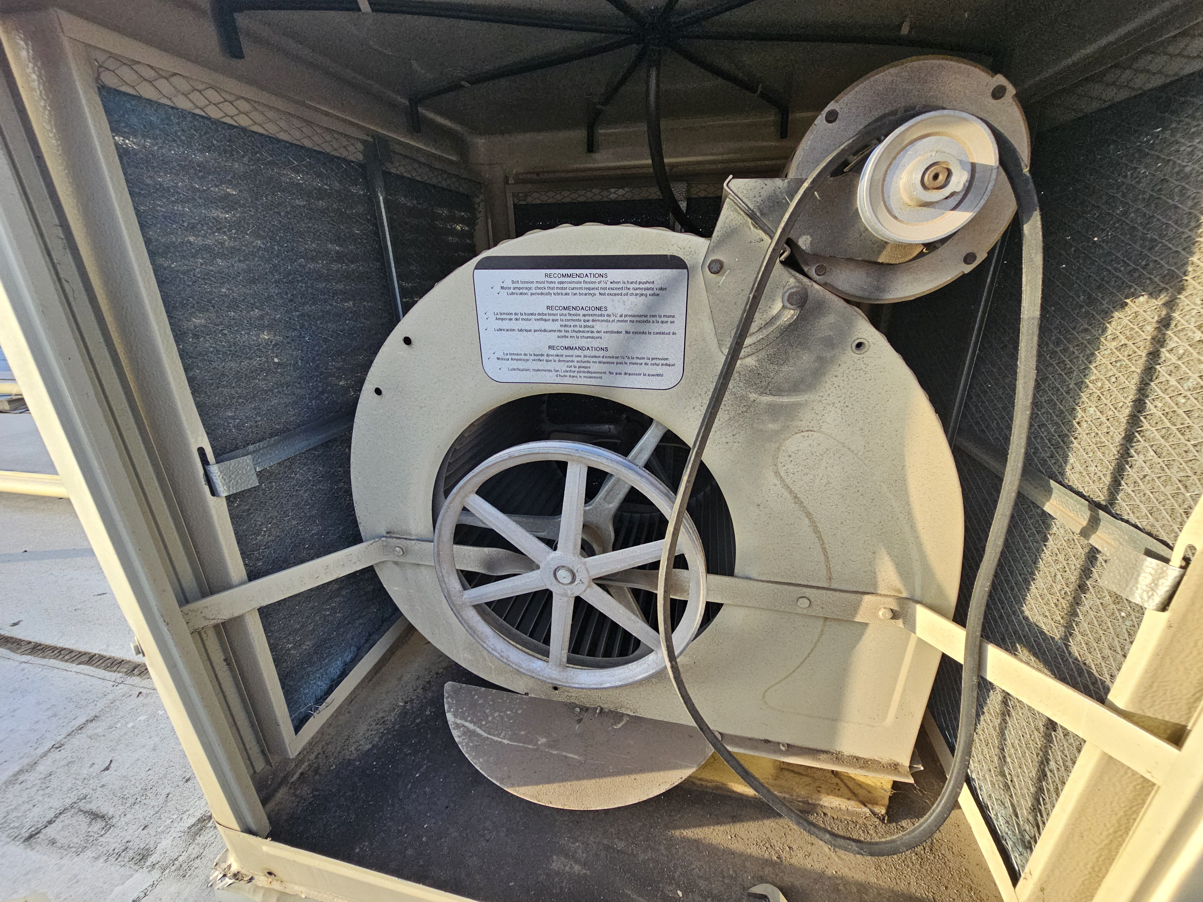 Inside view of a commercial HVAC blower wheel during a maintenance inspection