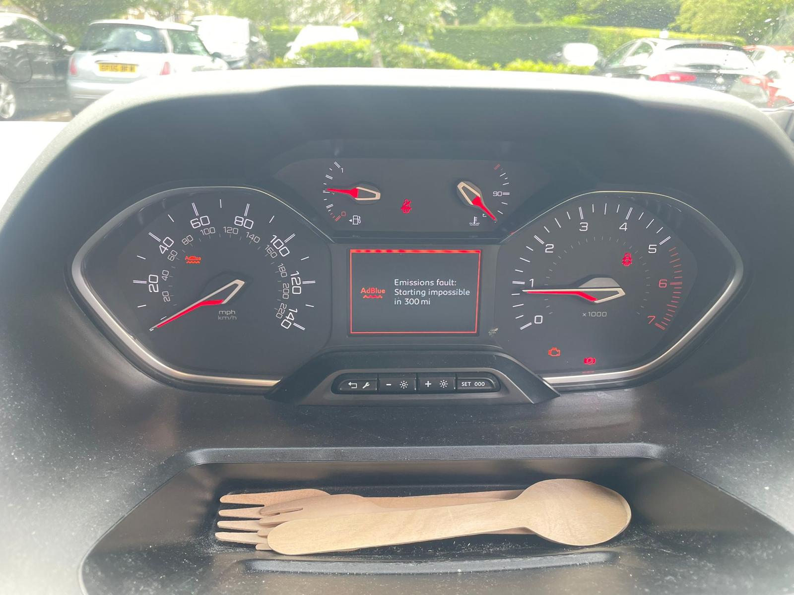 Peugeot 5008 dashboard showing AdBlue warning: “AdBlue Emissions fault: Starting impossible in 300 mi”