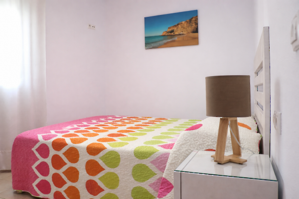 Apartamento Las Olas: dormitorio con cama doble