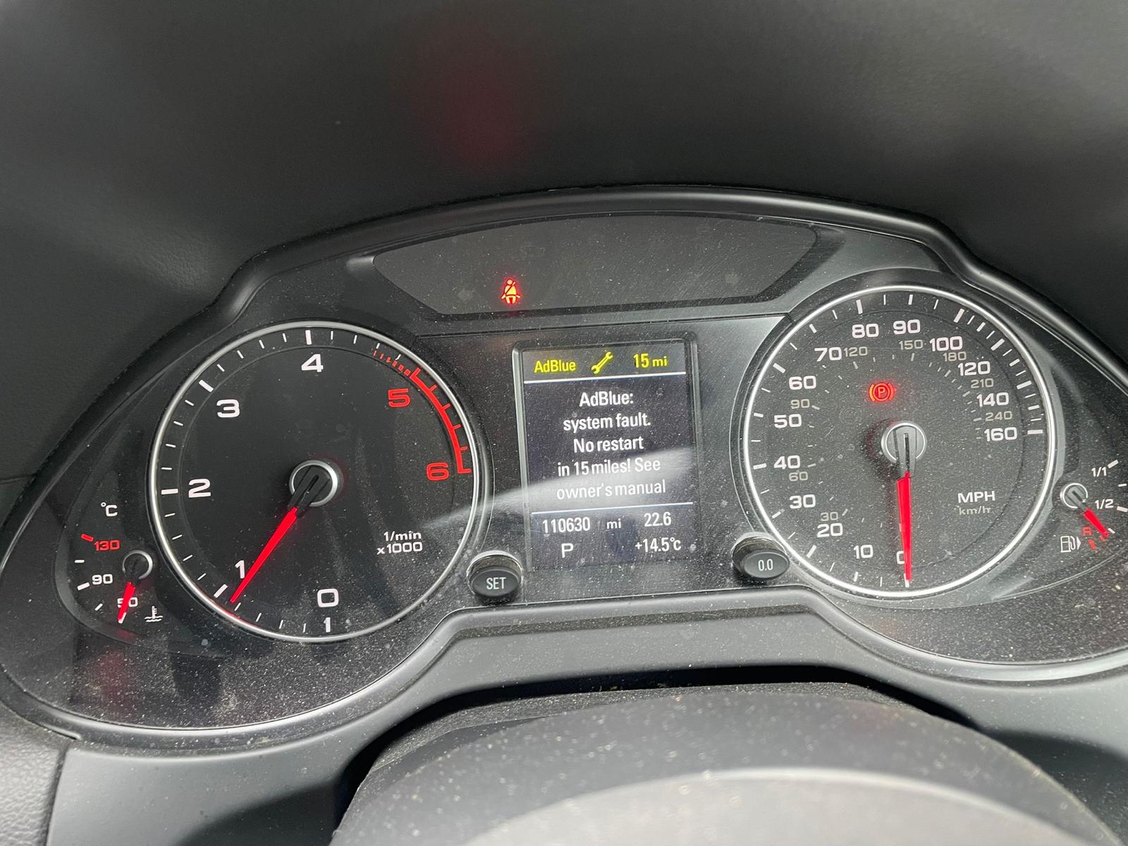 Audi dashboard showing AdBlue warning: “AdBlue: system fault. No restart in 15 miles! See owner's manual”