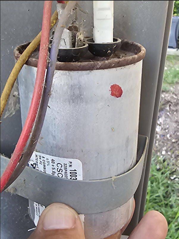 Failed dual run capacitor removed from a residential HVAC condenser unit in Allen, TX