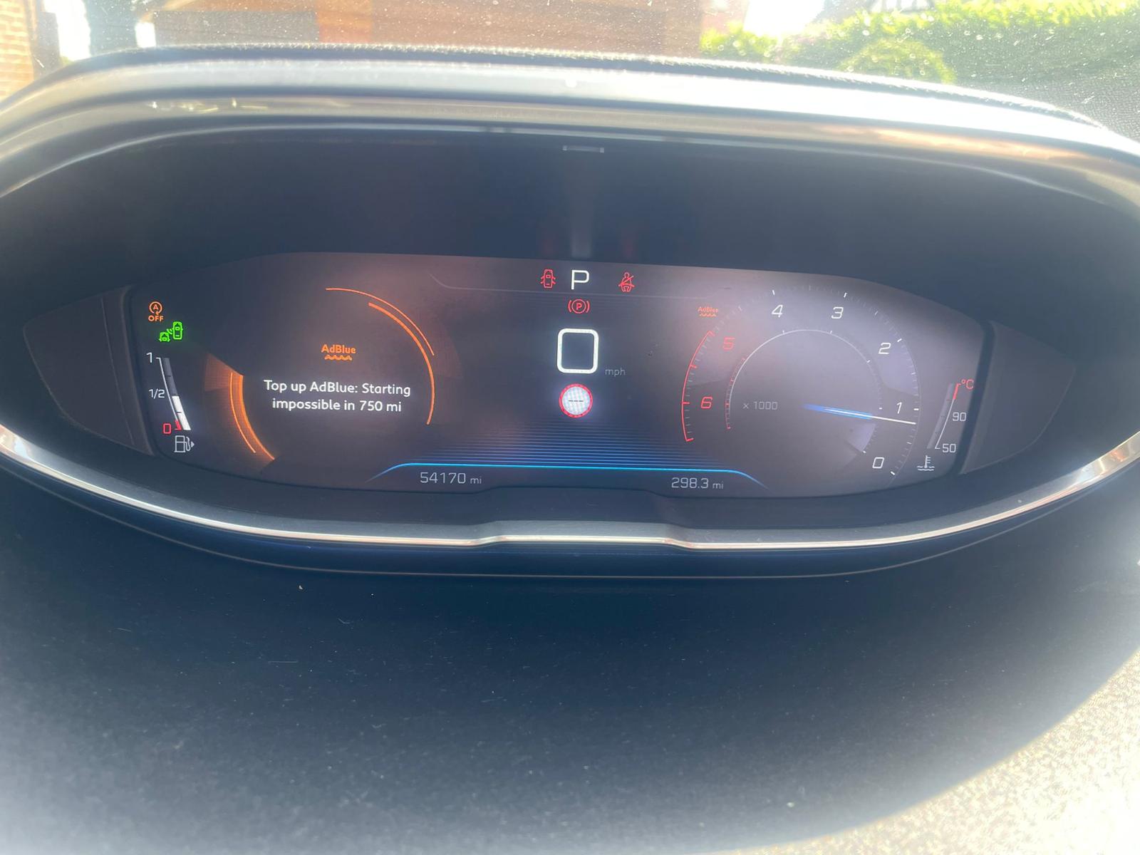 Peugeot (i-Cockpit) dashboard showing AdBlue warning: “Top up AdBlue: Starting impossible in 750 mi”
